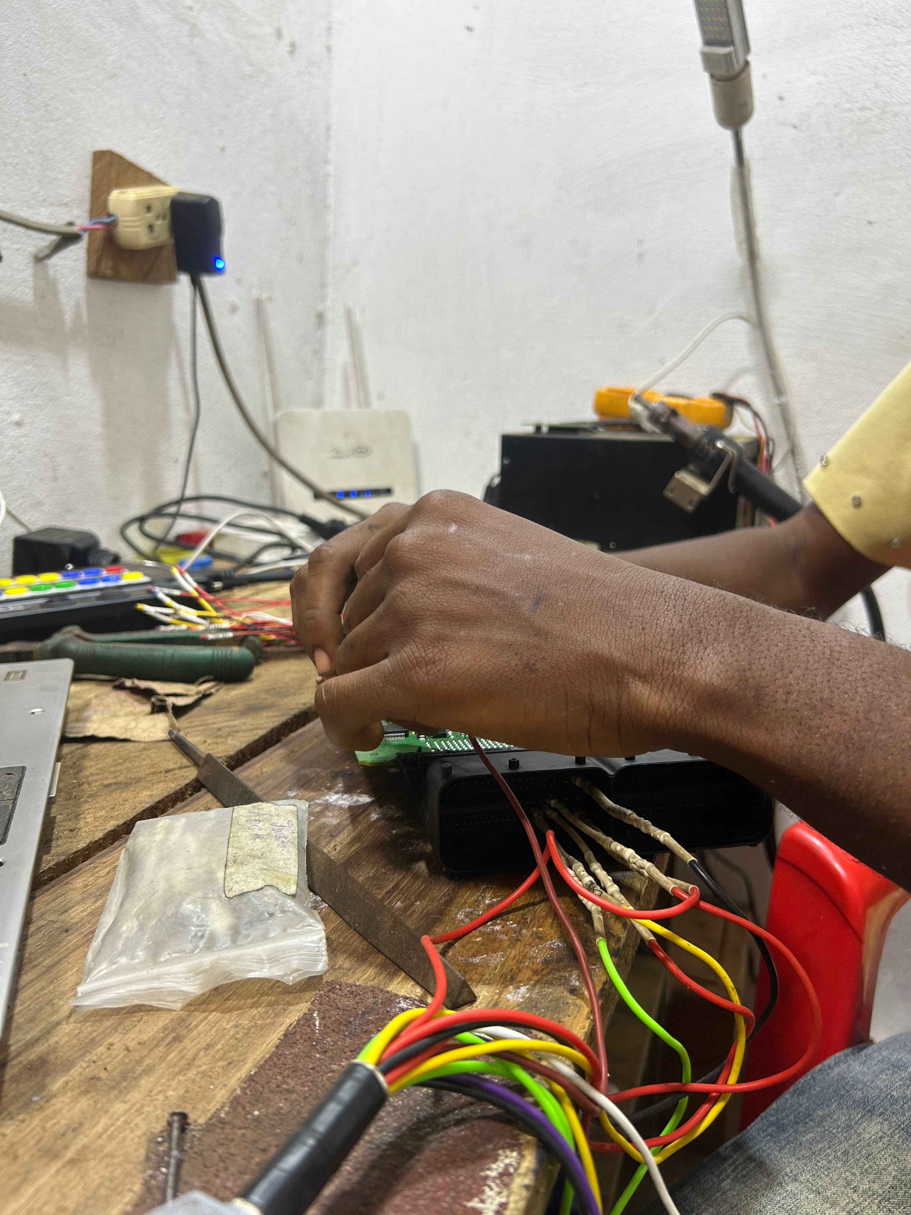 Auto electrical diagnostics and programming at Lass Electrical Zone workshop in Monrovia